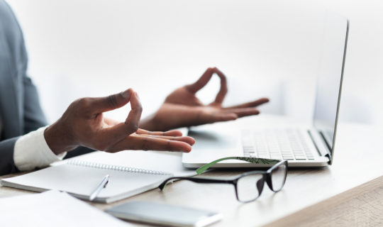 woman meditating in office