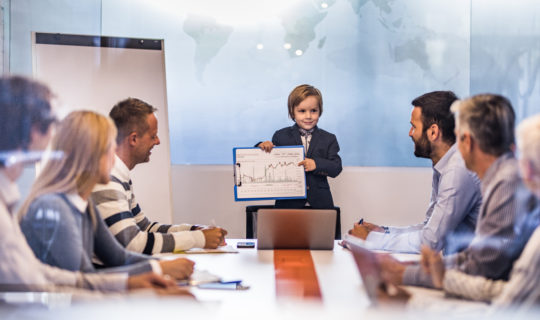 Young business boy showing the team reports in meeting