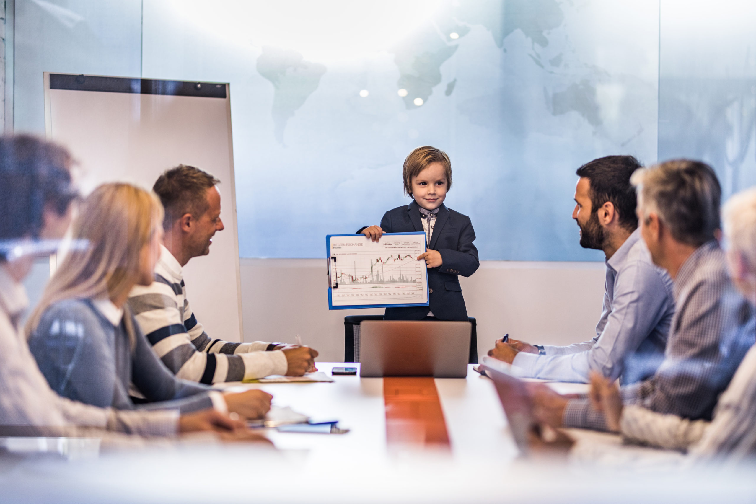 Young business boy showing the team reports in meeting