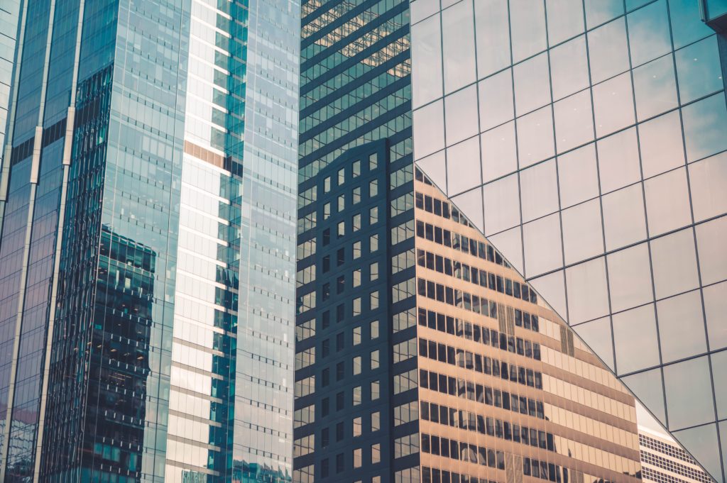 large office buildings with reflective walls and windows