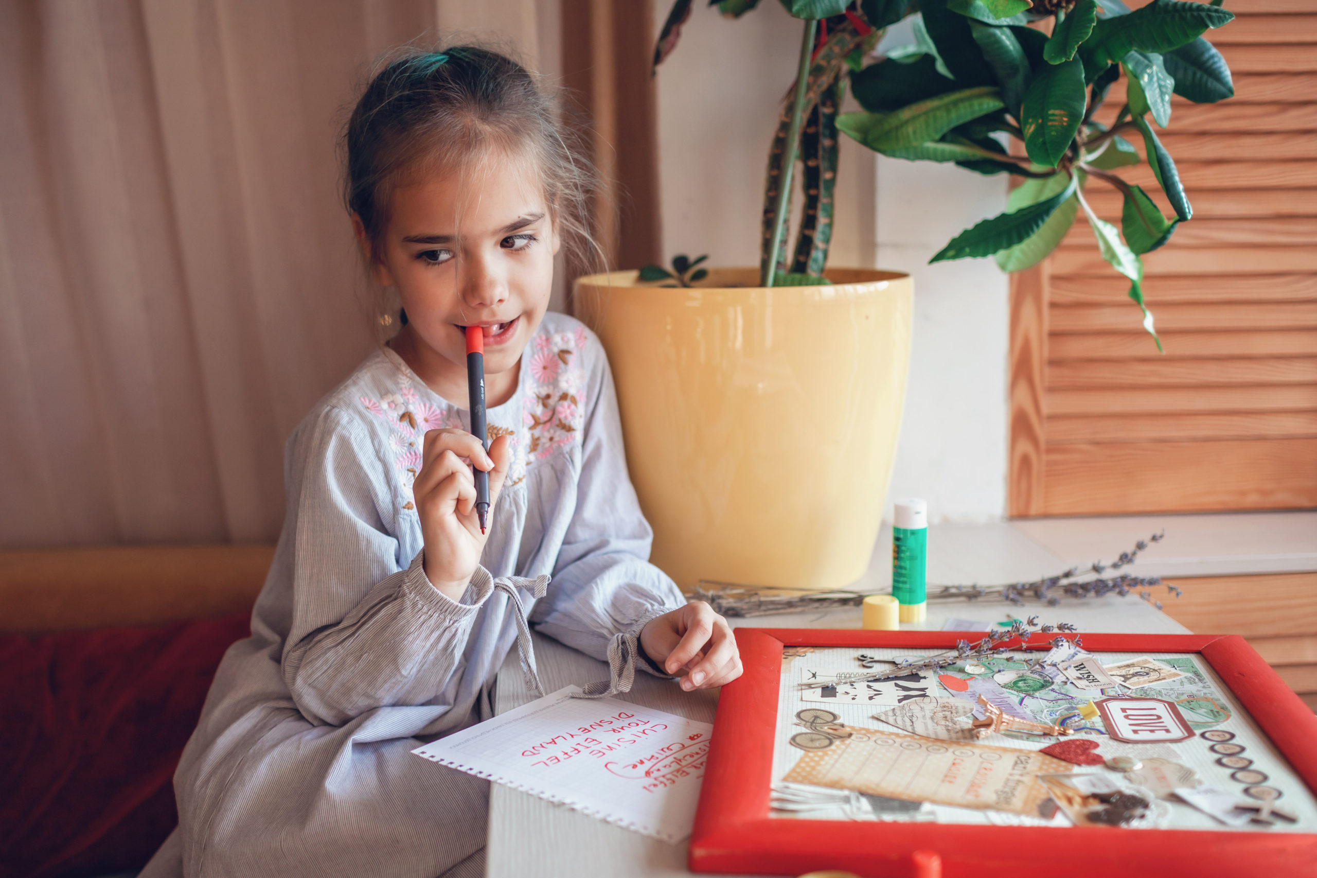 Little girl creating vision board